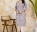 Stylish Indian woman wearing a designer embroidered kurti showcasing the latest women's fashion trends for 2026.